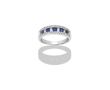 A Sapphire and Diamond Half Hoop Ringfive round cut sapphires alternate with six baguette cut diamonds, flanked by rows of ro