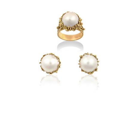 A 9 Carat Gold Mabe Pearl Ring and Matching Earringsthe mabe pearl within a yellow branch motif frame, to a forked shoulder p