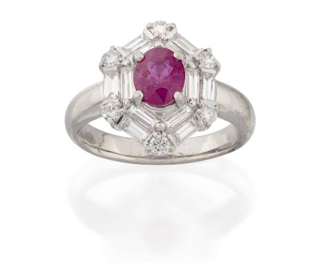 A Ruby and Diamond Cluster Ringthe oval cut ruby in a double border of baguette cut diamonds with round brilliant cut diamond