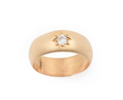 An 18 Carat Gold Diamond Solitaire Ringthe old cut diamond in a yellow star setting, to a plain polished shank, estimated dia