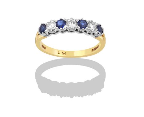 An 18 Carat Gold Sapphire and Diamond Seven Stone Ring the four round cut sapphires alternate with three round brilliant cut 