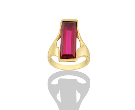 A Synthetic Ruby Ringthe step cut synthetic ruby in a yellow elongated claw setting, to a forked shoulder plain polished shan