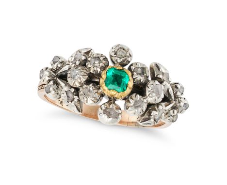 AN ANTIQUE EMERALD AND DIAMOND RING set with an octagonal step cut emerald accented by rose cut diamonds in a foliate motif, 