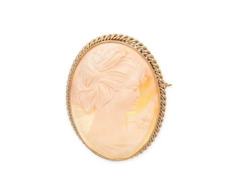 A VINTAGE SHELL CAMEO BROOCH in yellow gold, set with a shell cameo carved to depict the profile of a lady, within a twisted 