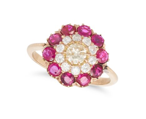 A RUBY AND DIAMOND CLUSTER RING in yellow gold, set with an old European cut diamond of approximately 0.31 carats in a cluste