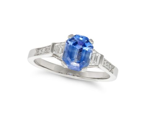 A SAPPHIRE AND DIAMOND RING set with an octagonal step cut sapphire of approximately 1.78 carats accented on each side by a t