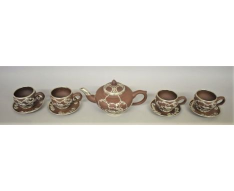 A Chinese yixing and white metal mounted part tea service,&nbsp;seal mark to base,&nbsp;decorated with dragons and stylized m