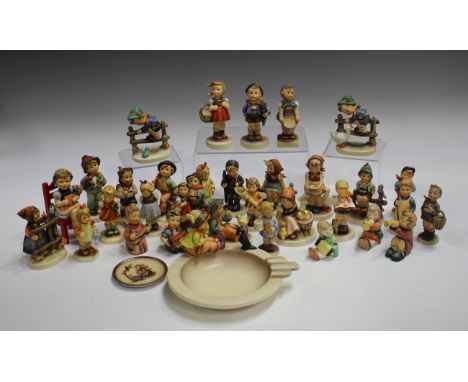 Thirty-two Goebel Hummel pottery figures, including Barnyard Hero and Wayside, together with a Goebel Hummel ashtray and a sm