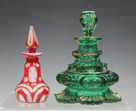 A Continental green glass scent bottle and stopper, late 19th century, of baluster shape with lobed and cut detail, heightene