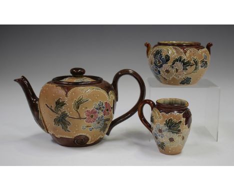 A Doulton Lambeth Slaters Patent three-piece tea service, late 19th century, decorated with blossom, comprising teapot and co