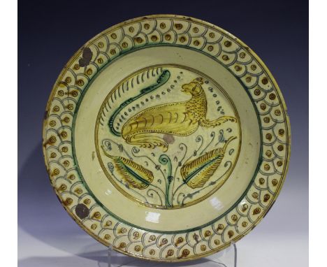 A large Italian pottery circular bowl, late 18th/19th century, incised and painted to the base interior in yellow and green w