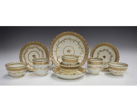 Three Caughley porcelain trios, circa 1790, of fluted form gilt with an undulating foliate band beneath a geometric band, tog