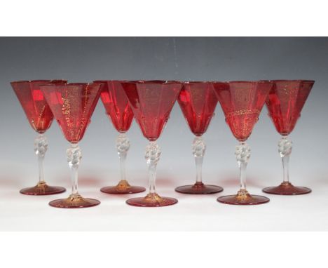 Seven Venetian ruby glass wines with aventurine decoration, height 17.5cm, a 19th century cut glass decanter and a pair of ru