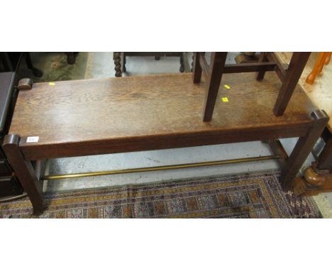 Mid 20th Century rectangular oak bench with brass shoe rack.