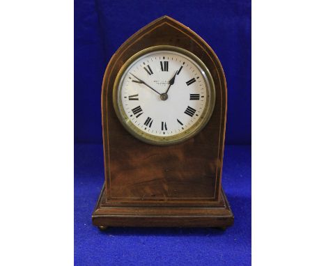 Early 20th Century inlaid mahogany lancet shaped mantle clock with a French brass movement.