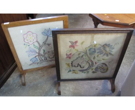 Two similar oak framed, floral tapestry fire screens (2).