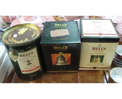Three boxed Bells Old Scotch Whiskey Wade decanters to include Christmas 1988, 1995 and 1998.  (3)