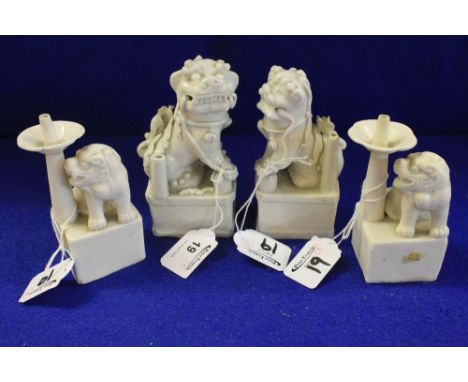Pair of Chinese blanc de chine Dog of Fo candlesticks and two further similar Dog of Fo quill stands.  (4) CONDITION REPORT: 
