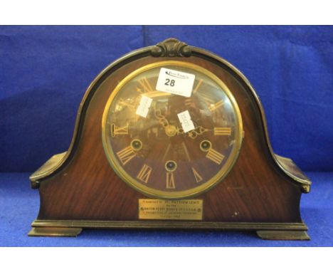 Mid 20th Century mahogany hat shaped presentation three train mantle clock.