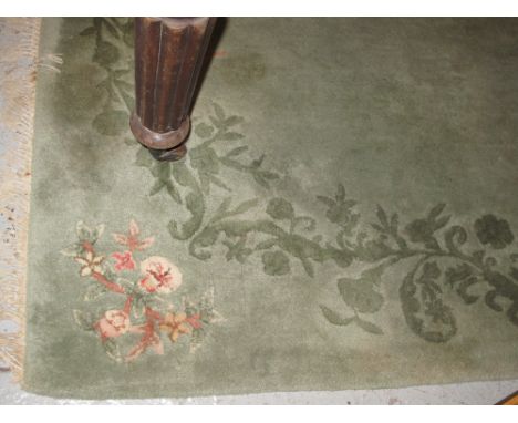 Large green ground floral and foliate modern carpet.