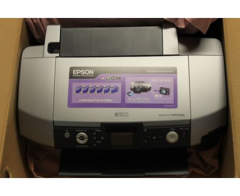 Epson stylus photo R340 series printer together with operations manual.