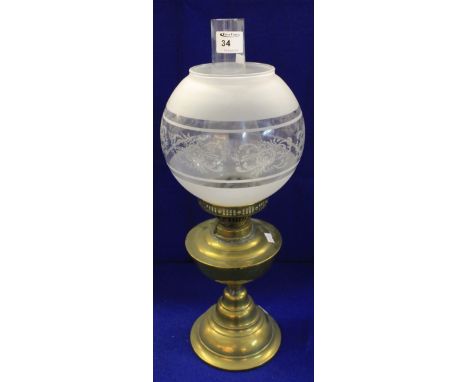 Brass double burner oil lamp with etched shade and clear glass funnel.