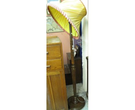 20th Century oak standard lamp with shade.