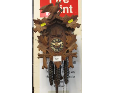 Modern carved cuckoo clock.