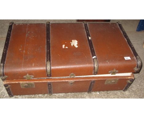 Vintage travelling trunk with metal banding.