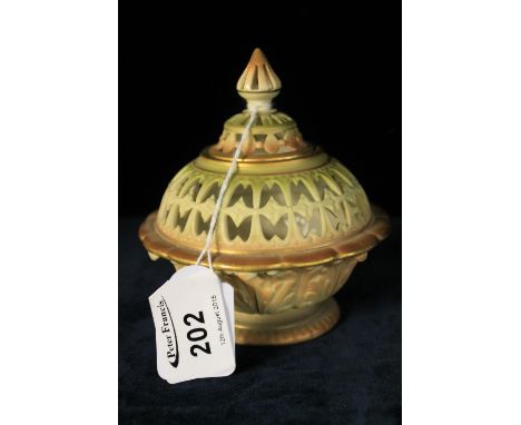 Royal Worcester porcelain blush ivory pierced potpourri jar and cover.  Printed green marks to base, shape number 76/G.