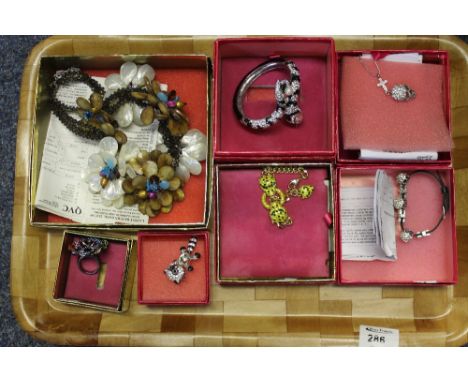 Collection of Butler and Wilson 40th anniversary jewellery to include snake bangle, skull pendant, flower ring etc.