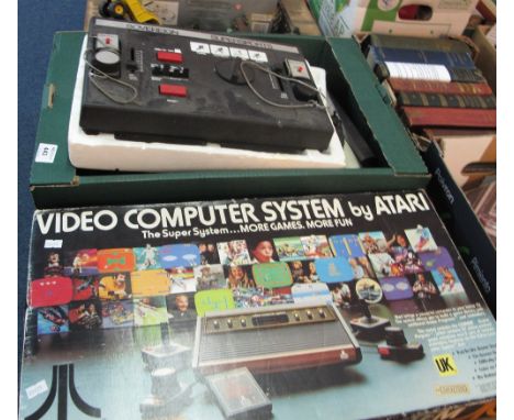 Atari video computer system console in original box together with sovereign super sports console.  (2)