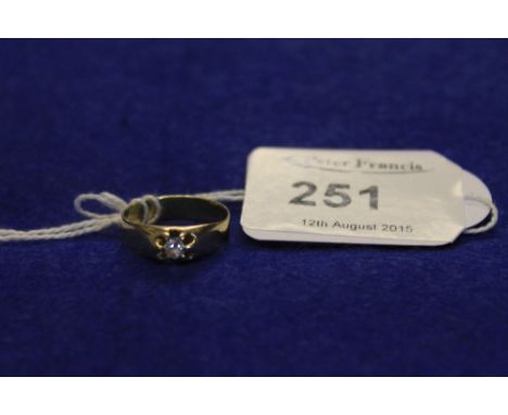 Yellow metal diamond ring.