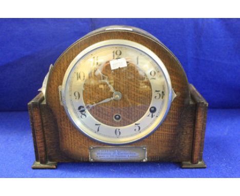 Mid 20th Century oak arch shaped three train presentation mantle clock presented on behalf of the British Legion. 