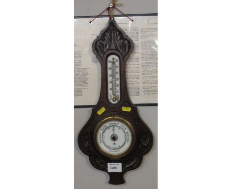 Early 20th Century small oak carved aneroid wall barometer.