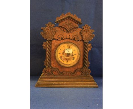 American Ansonia clock company stained wooden gingerbread type architectural mantle clock with spiral and foliate mouldings a