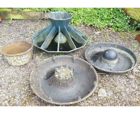 A cast iron ten-sided pig trough, together with two circular cast iron pig troughs, and a cast iron feeding pot (4)