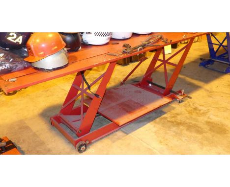 A Silverline motorcycle repair bench, with hydraulic rise-and-fall action, painted in red enamel1000lbs (454kg)