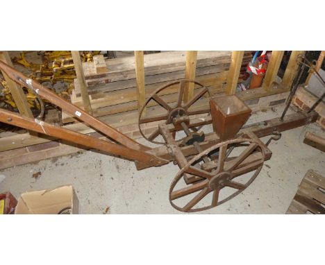A vintage wooden seed drill