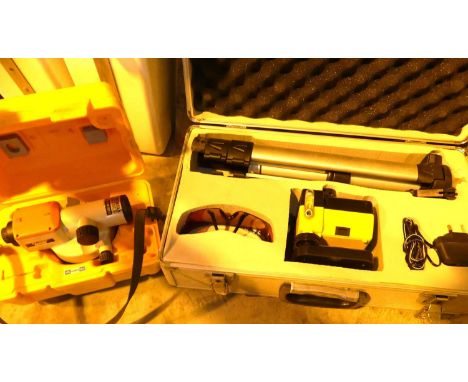 A cased theodolite, with tripod; together with a Pentax AL-220 surveyor's sight (2)