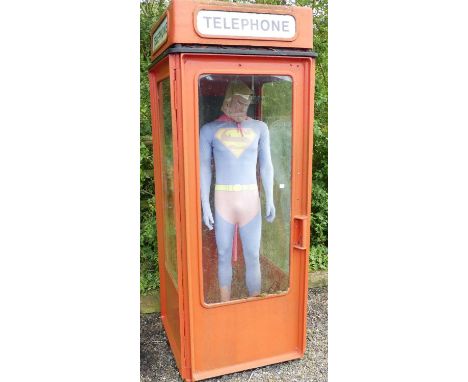 A GPO telephone box, complete with telephone and mannequin dressed in Superman outfit