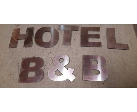 A mixed lot containing brushed metal Hotel and B&amp;B letters, h.25cm, Lounge and Toilet hanging signs, 22 x 31cm, a single 