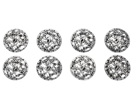 A set of eight silver buttons by Thomas White, 1901, of pierced foliate design, maker’s mark, London hallmark, diameter 30mm.
