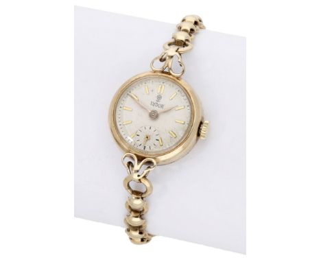 Tudor. A lady’s gold bracelet watch, circa 1956. Movement: cal. 2325, manual winding, 15 jewels. Dial: silvered, applied bato