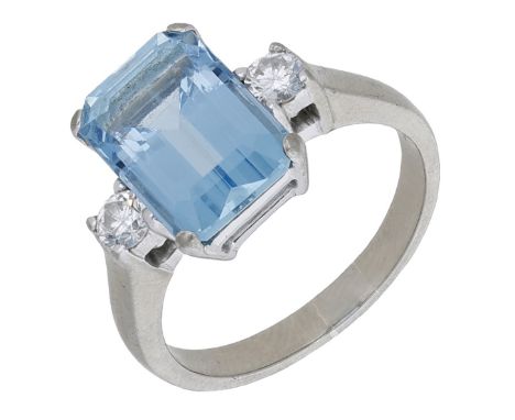 An aquamarine and diamond ring, the step-cut aquamarine between brilliant-cut diamond shoulders, stamped ‘750’, ring size P. 