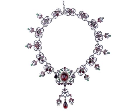 A late 19th century Austro-Hungarian fringe necklace, the quatrefoil links set with garnets, pearls and green gemstones, susp