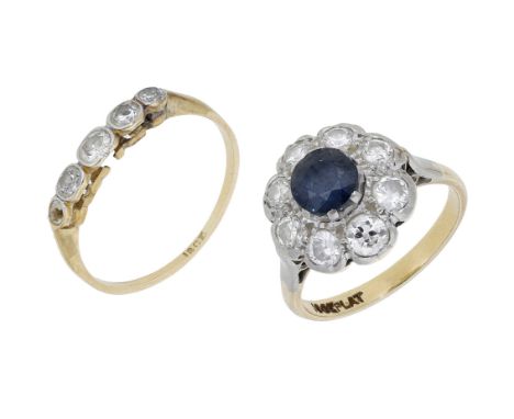 A sapphire and diamond cluster ring and a diamond ring, the  circular-cut sapphire claw-set within a surround of brilliant-cu