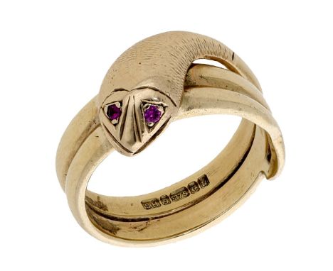 A 9ct gold serpent ring, modelled as a coiled serpent, with synthetic ruby eyes and textured finish, Birmingham hallmark for 