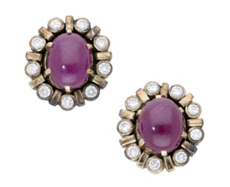 A pair of ruby and diamond ear studs, the oval ruby cabochons within a surround of brilliant-cut diamonds, total diamond weig