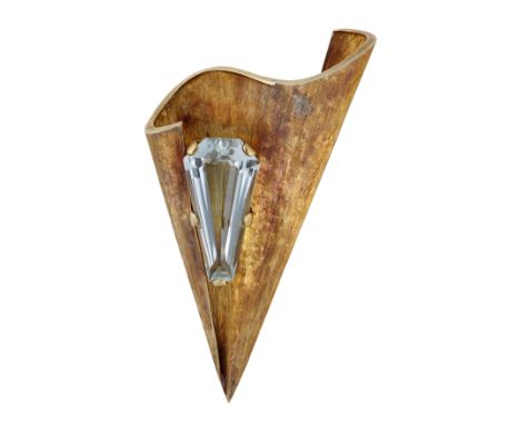 An aquamarine brooch, of tapered, undulating form and centred with a fancy-cut aquamarine in a raised claw setting with satin